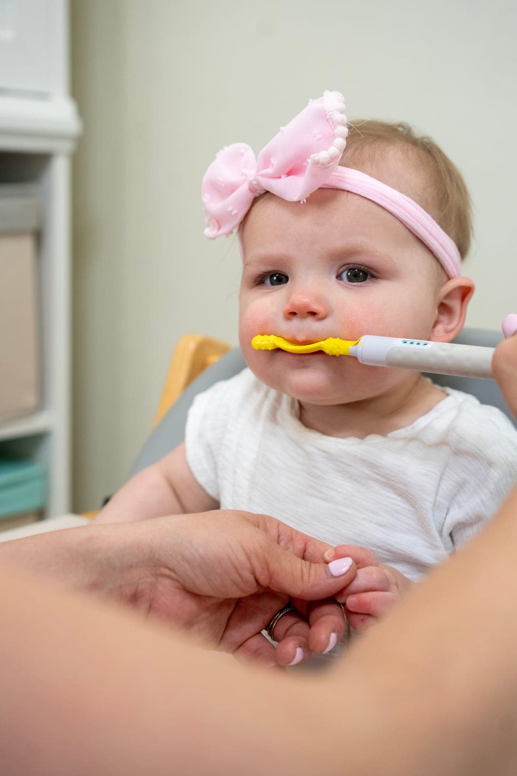 Young client exploring a new food during a feeding therapy session