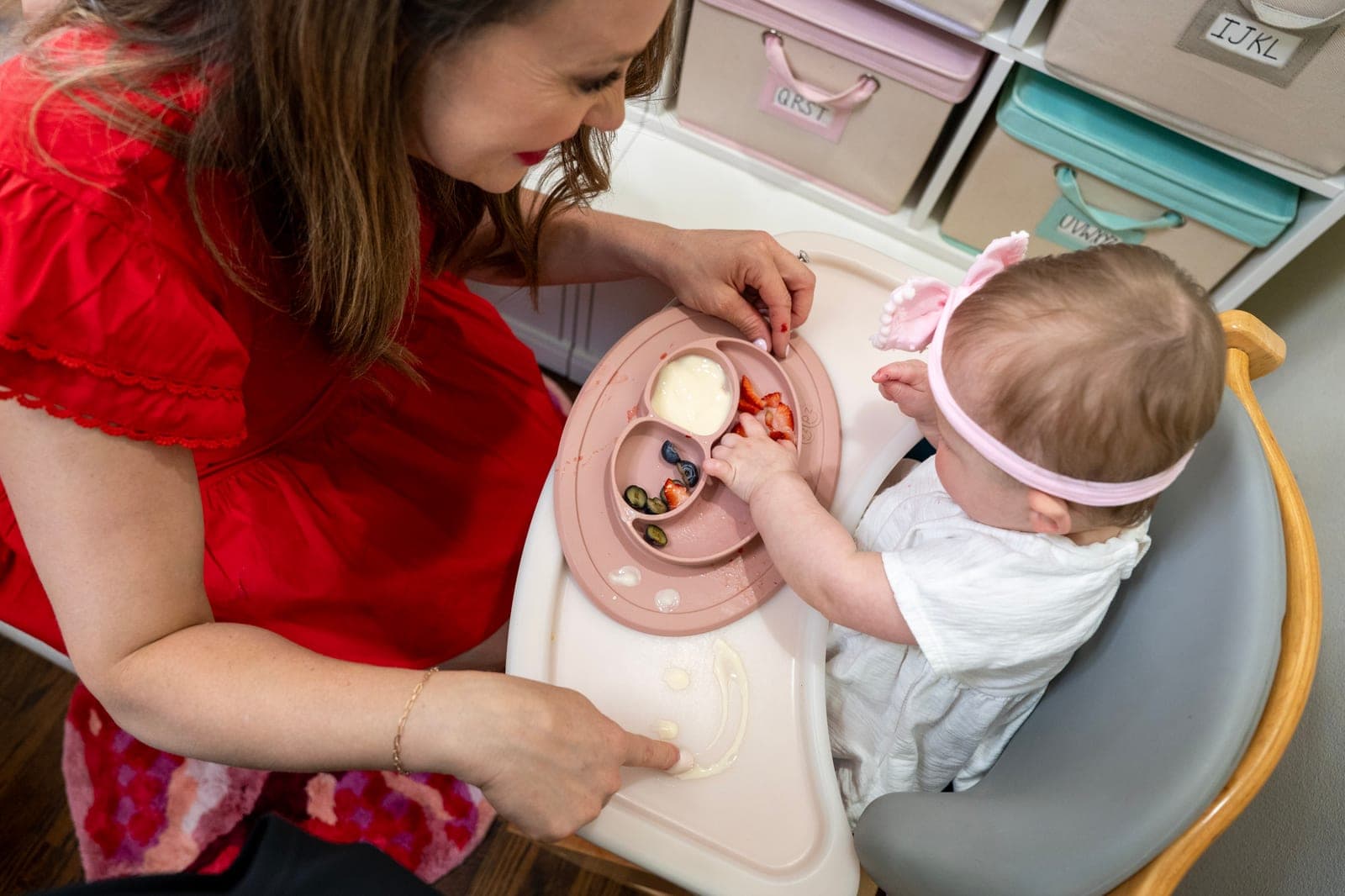 Laura coaching a young client through a feeding moment